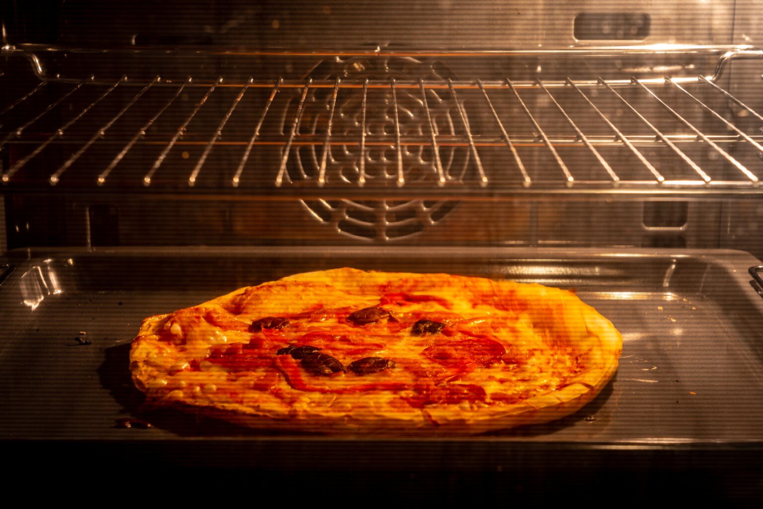 How to reheat pizza the best way possible. This easy-to-follow guide will show you how to reheat your pizza in a microwave or oven, without burning it, and how long it takes.