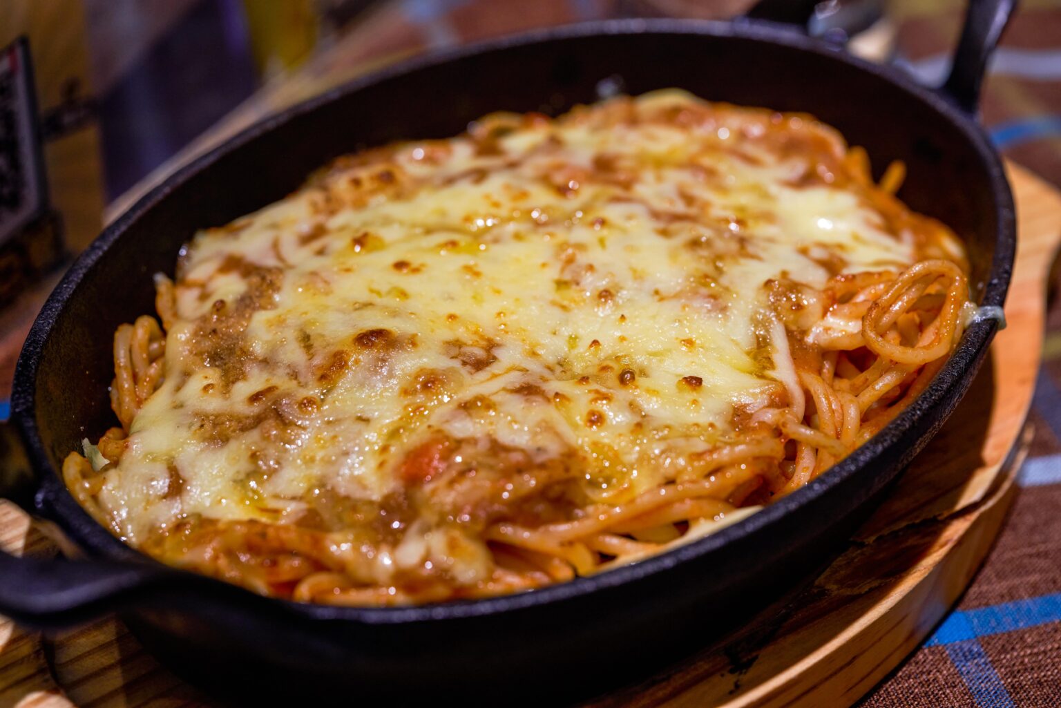 This easy and delicious baked spaghetti recipe is perfect for a family dinner or get-together.