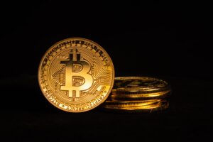 Bitcoin is a cryptocurrency, digital money, and payment network created in 2009 by an unknown person using the alias Satoshi Nakamoto. Find out what it is, how to use it, whether you should invest in it, and more.