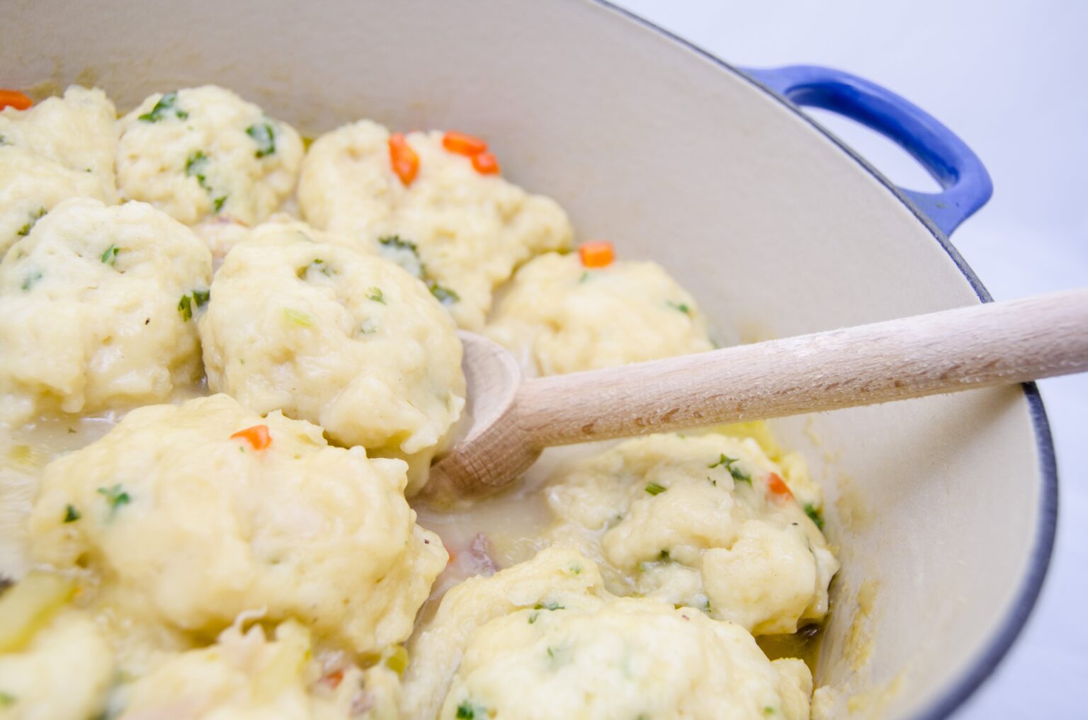 Old Fashioned Chicken and Dumplings is a delicious homemade meal. Tender dumplings are made from scratch and simmered in a delicious chicken broth.