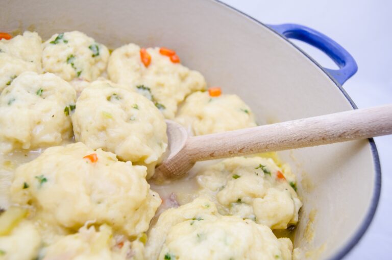 Old Fashioned Chicken and Dumplings is a delicious homemade meal. Tender dumplings are made from scratch and simmered in a delicious chicken broth.